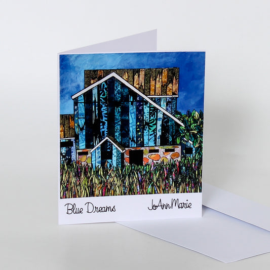 art card of blue house in field 