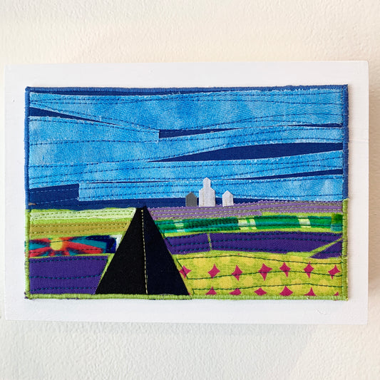 Blue and green fiber art of a Saskatchewan landscape