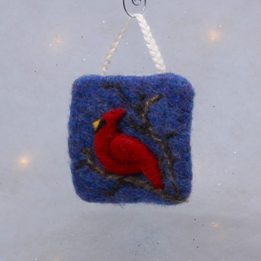 Red cardinal on blue, felted ornament