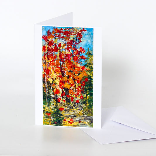 Greeting card with a colorful autumn leaf design on a white background