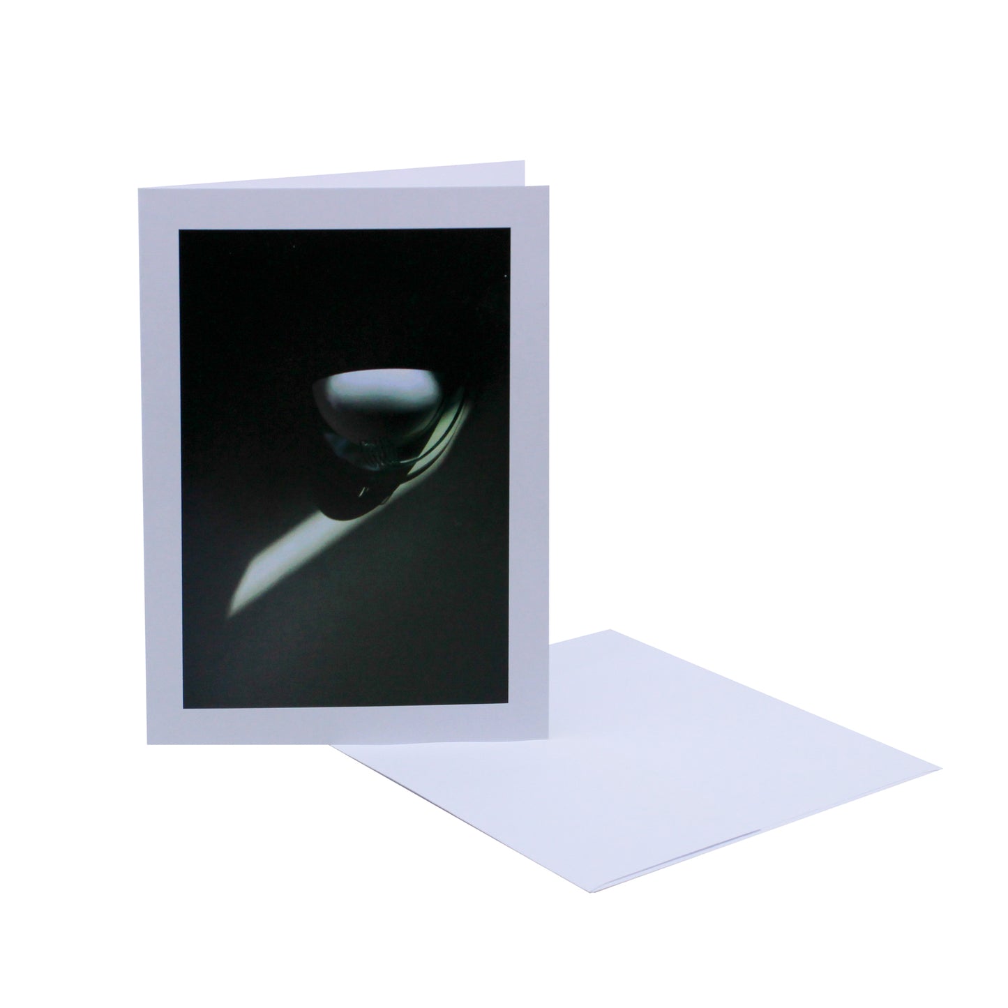 Greeting card of a lighting sconce in shadows 