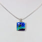 Necklace with a square pendant featuring a green star design on a light gray background