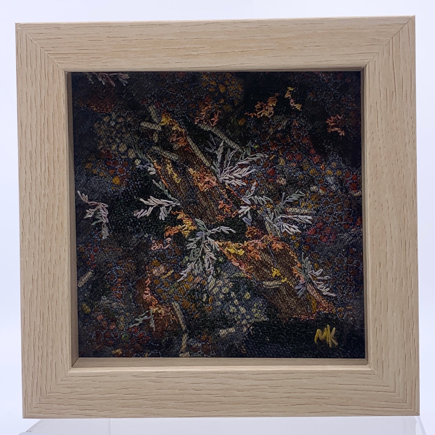Framed Artwork of embroidered plants and wood