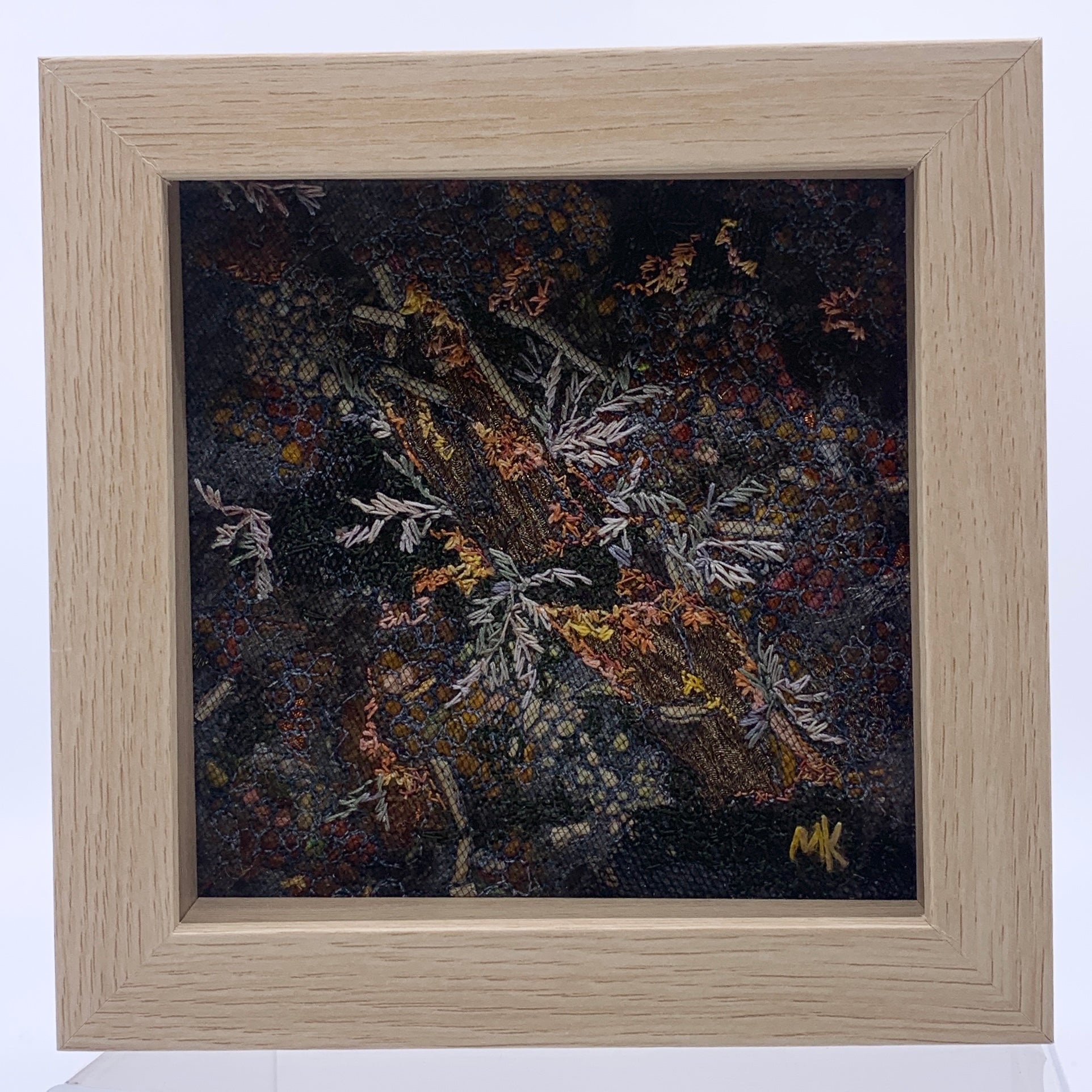 Framed Artwork of embroidered plants and wood