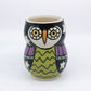 Dollie tumbler: owl with green belly and blue feathers and carved stars 