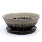 Brown and cream ceramic berry bowl strainer with saucer