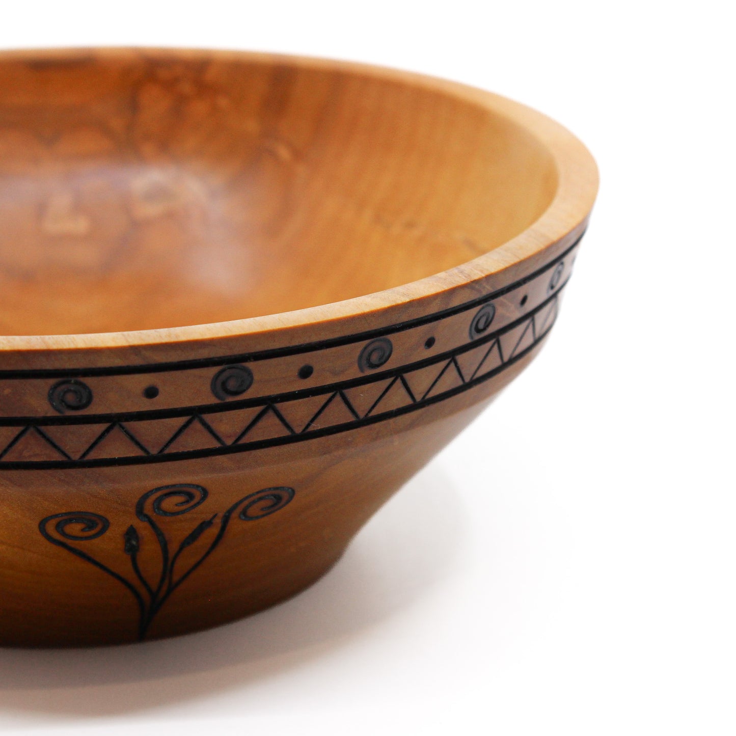 wood bowl with cattail motif and rim accent close up 