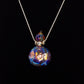 Necklace with a colorful glass pendant on a black background