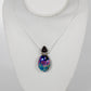 Necklace with a colorful pendant on a white background