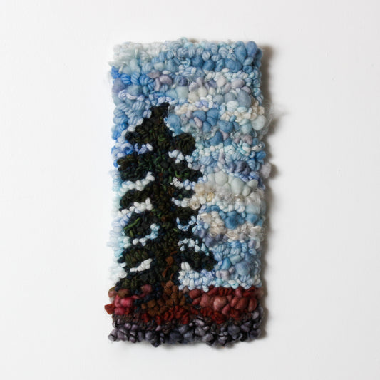 Textile art piece of spruce tree