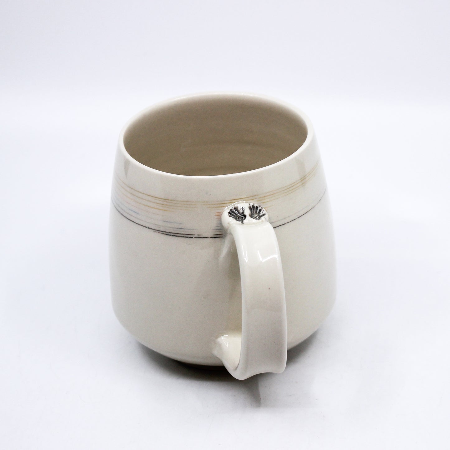 Handle of mug with hand print stamps