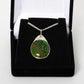 Green and red pendant on silver chain 