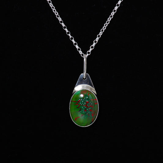 Green and red pendant on silver chain 