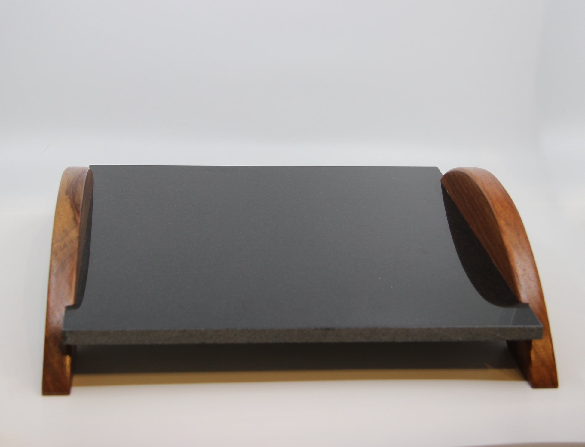 Shiny black stone serving tray with wood handles