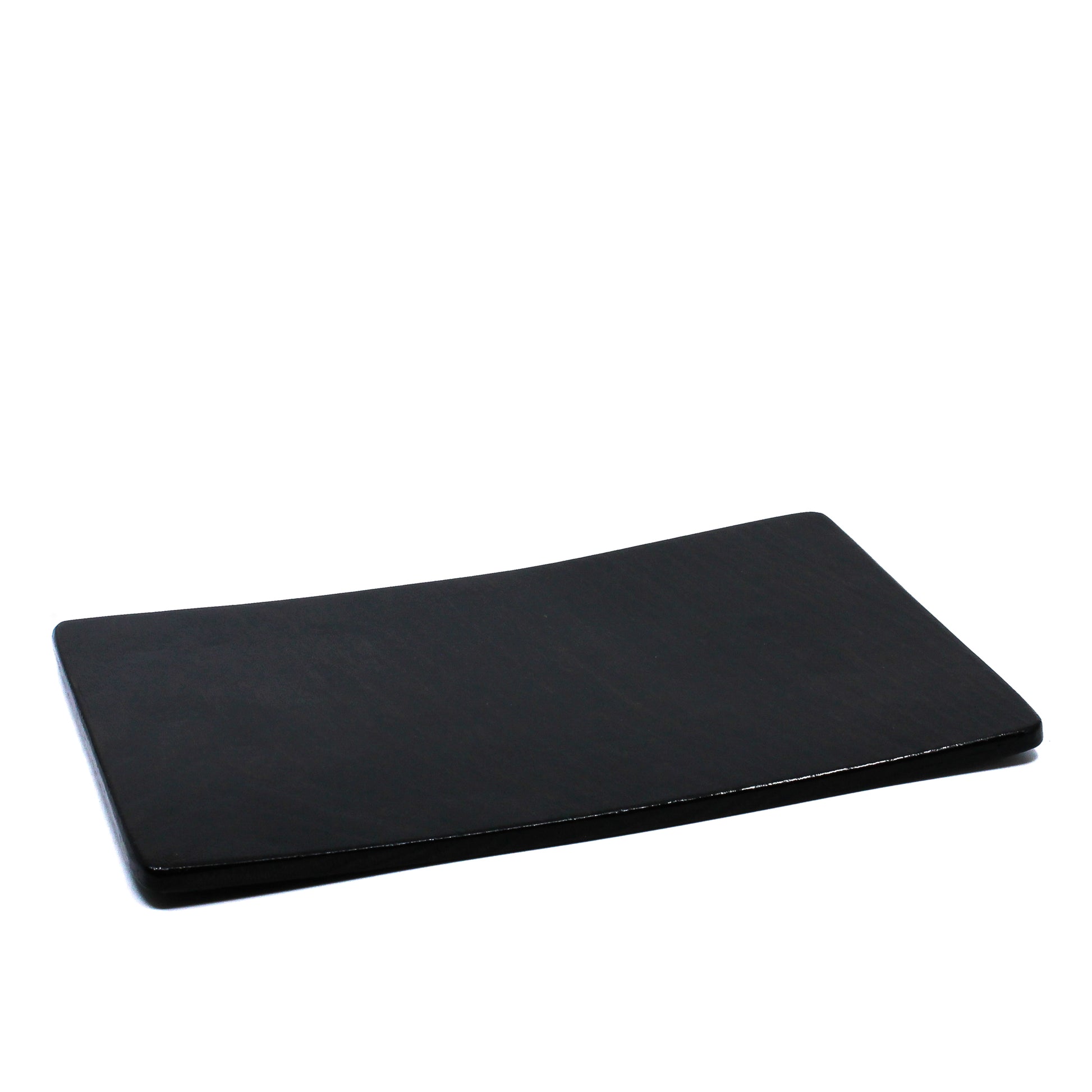 Thick black sushi tray with a warp