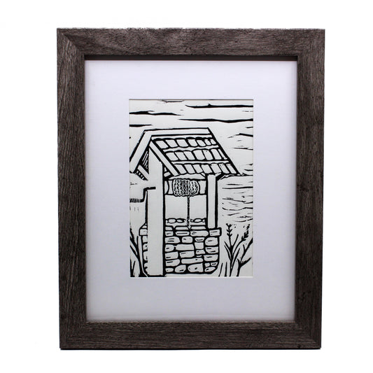 Linocut of stone well 