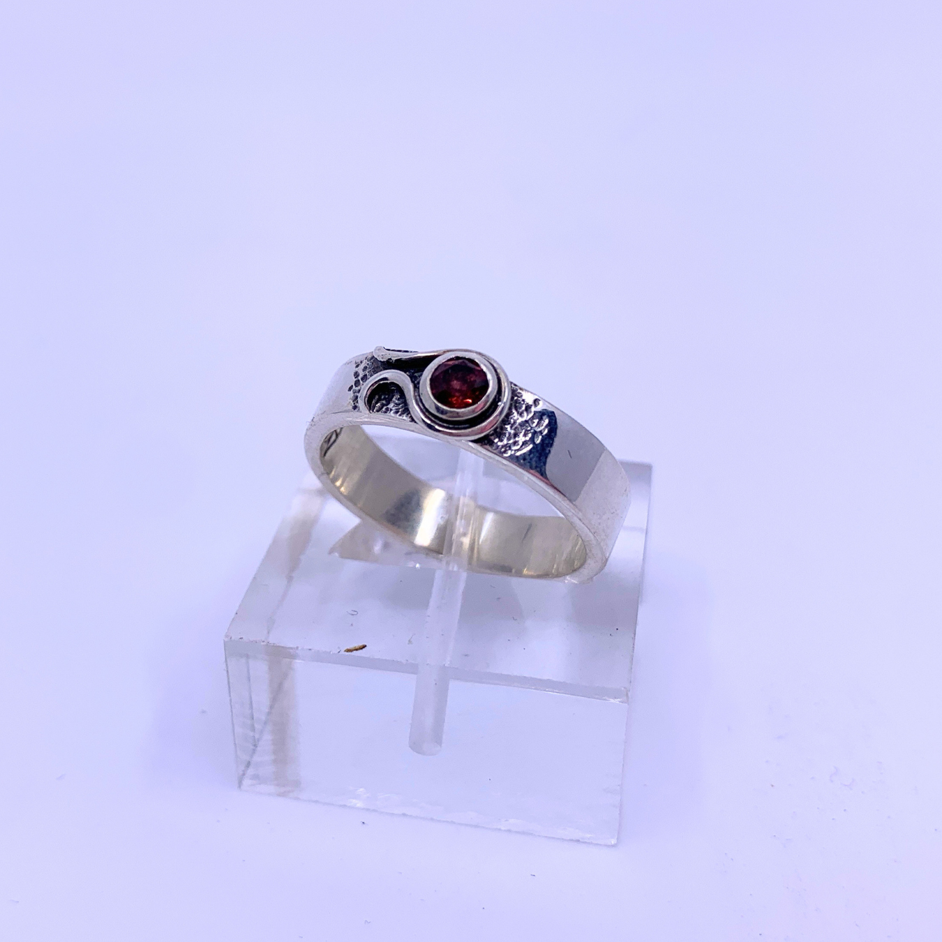 silver ring with red stone 