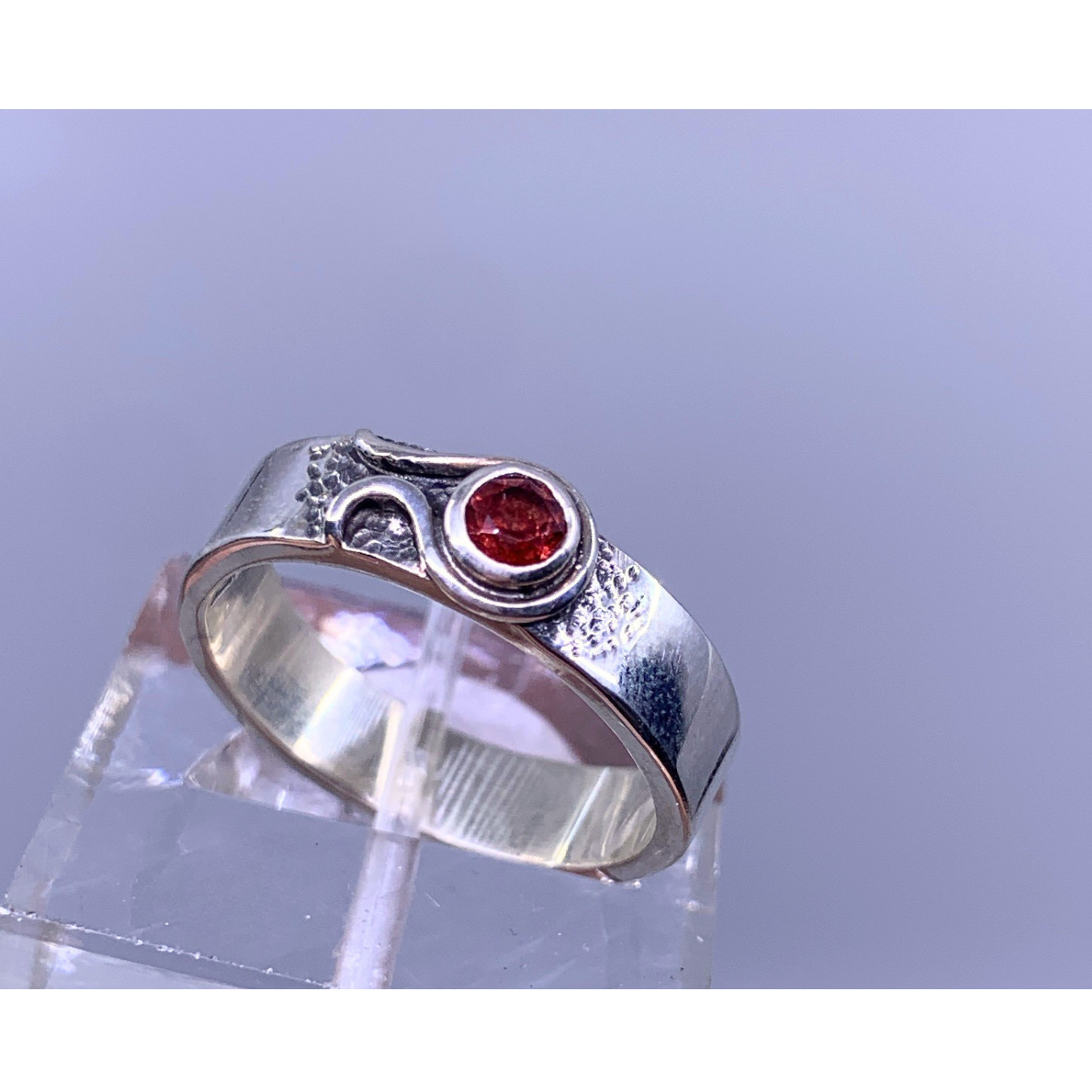 silver ring with red stone 