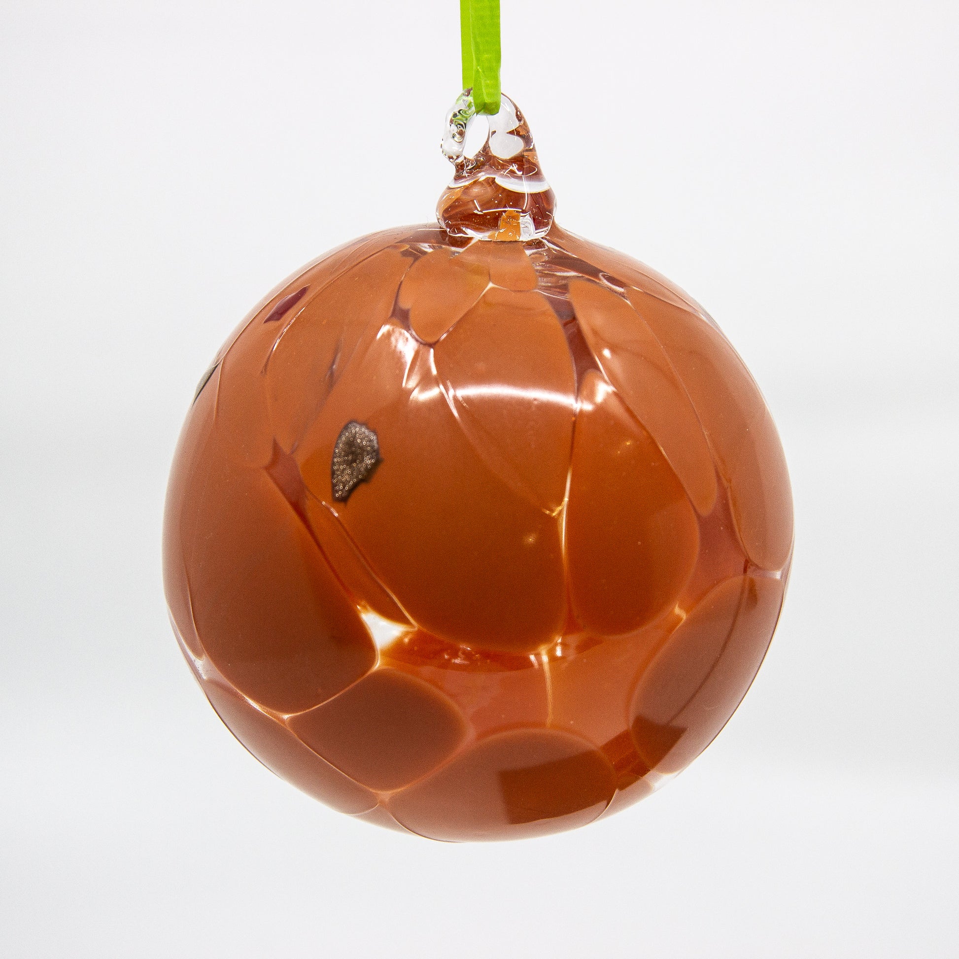 Sienna glass ball on green ribbon 