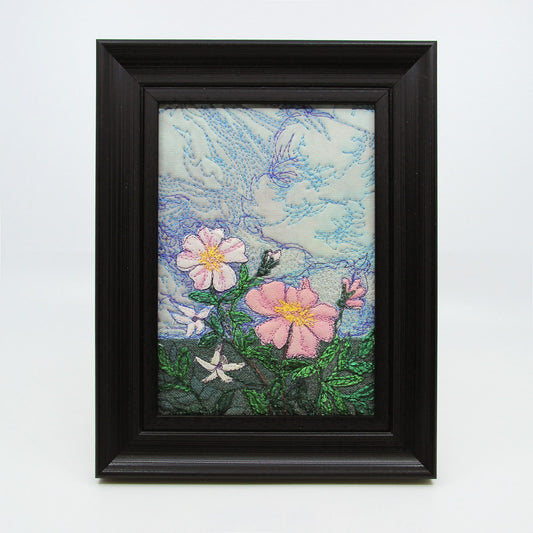 Embroidered painting of wild roses and sky