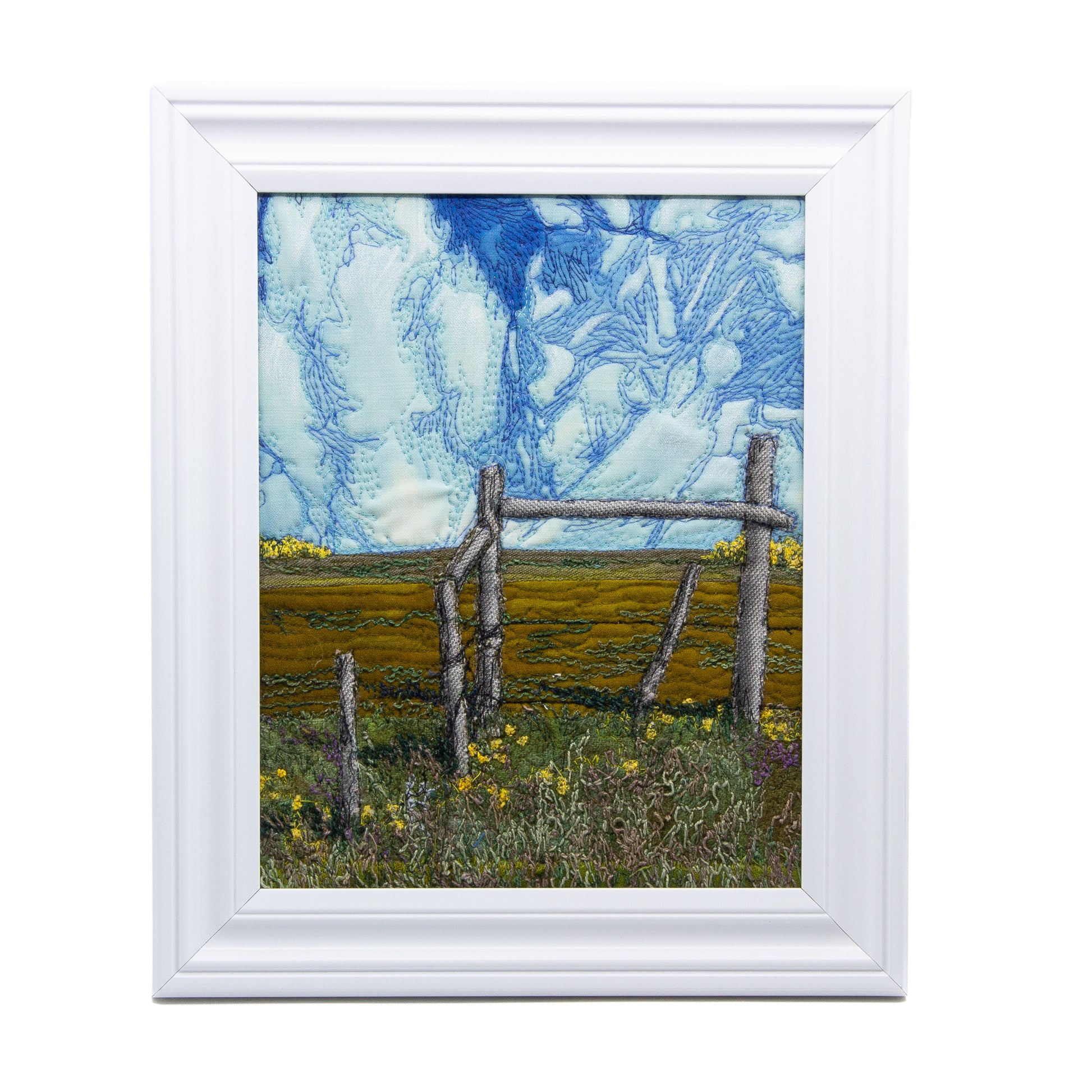 Thread embriodered painting of a fence in a prairie landscape 