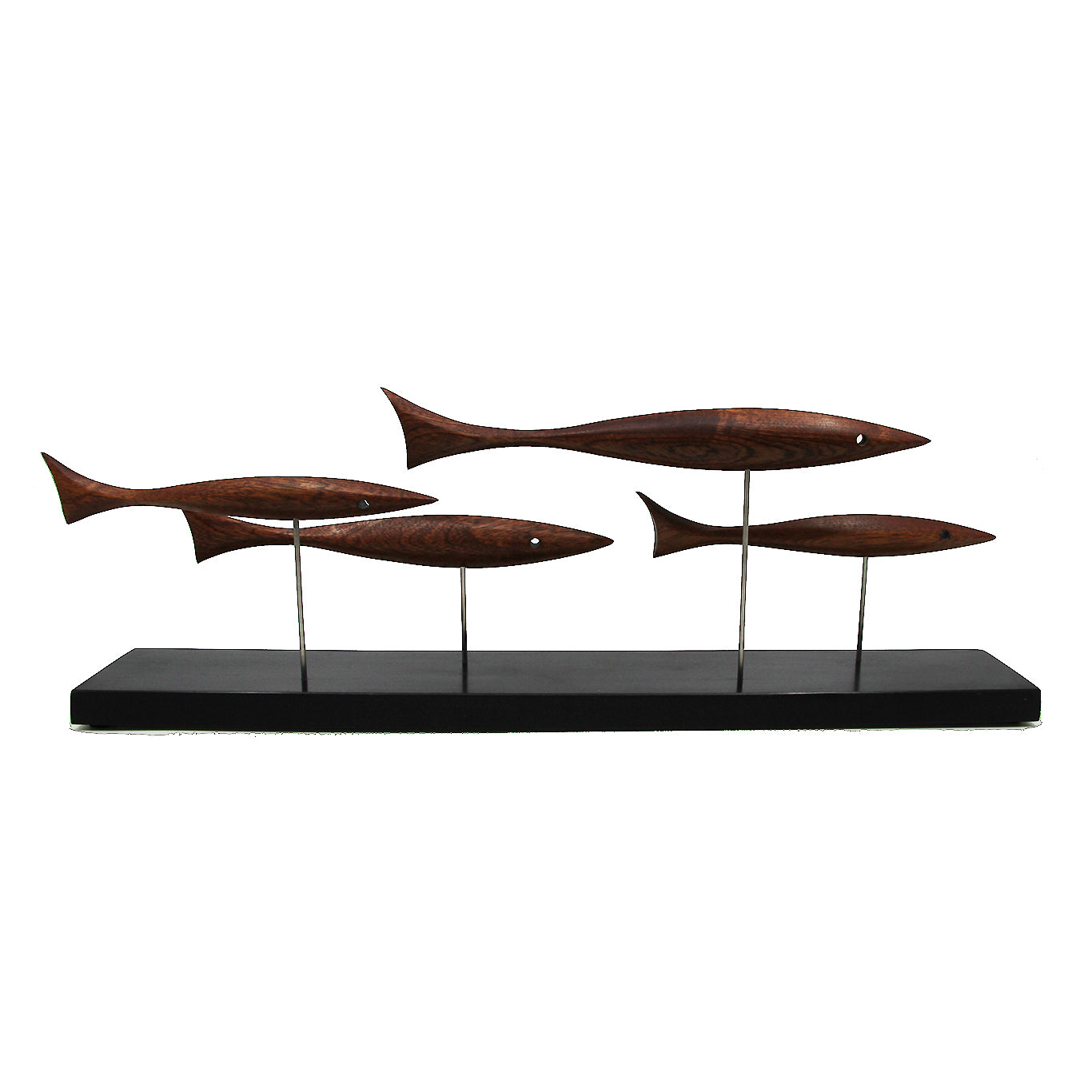 Four brown fish on a black stand 