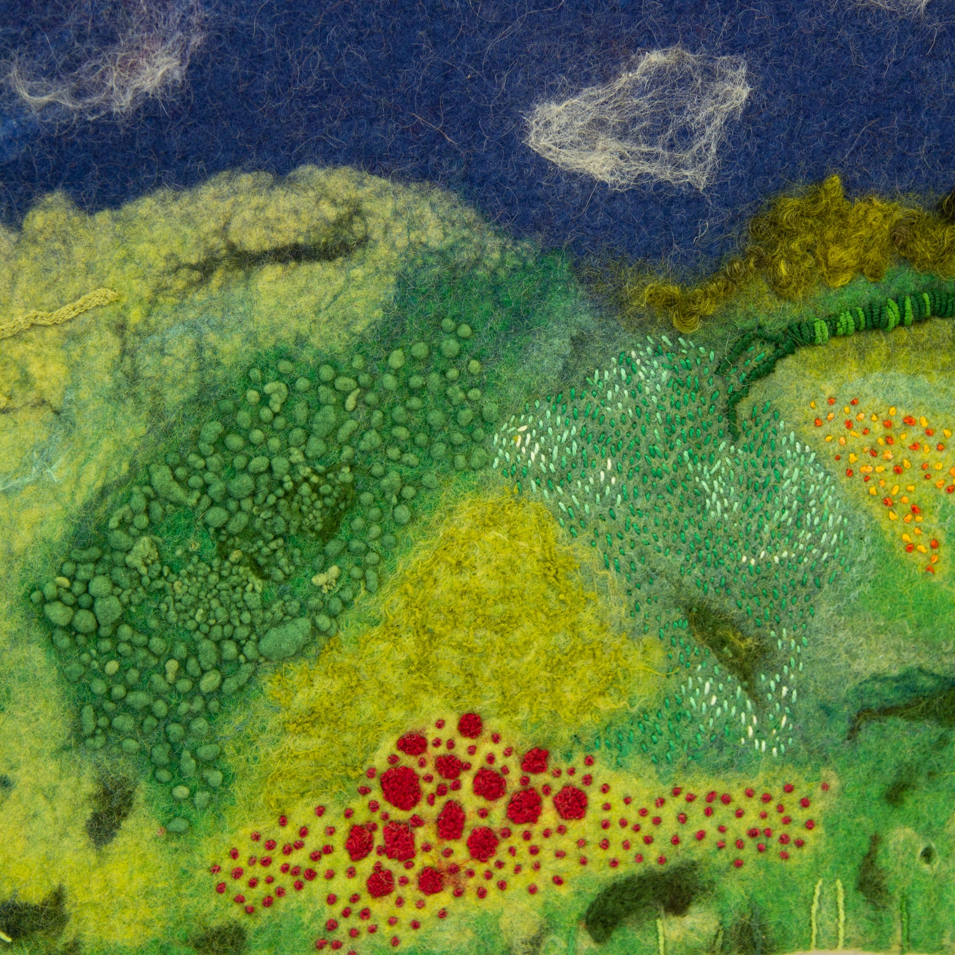 Close up of felted and embroidered landscape
