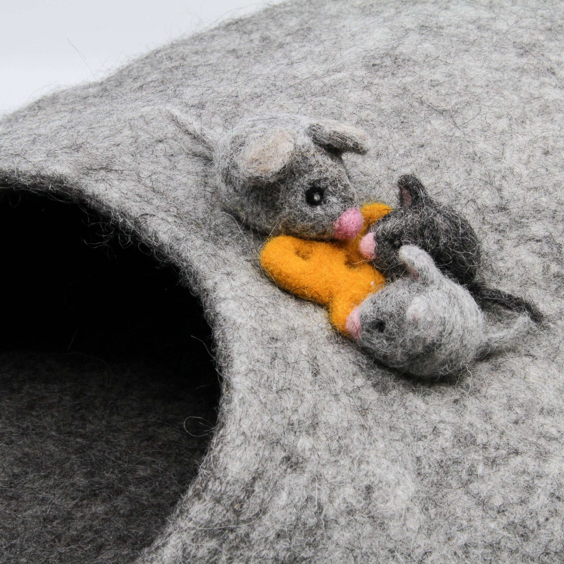 Grey felted mice on cat house