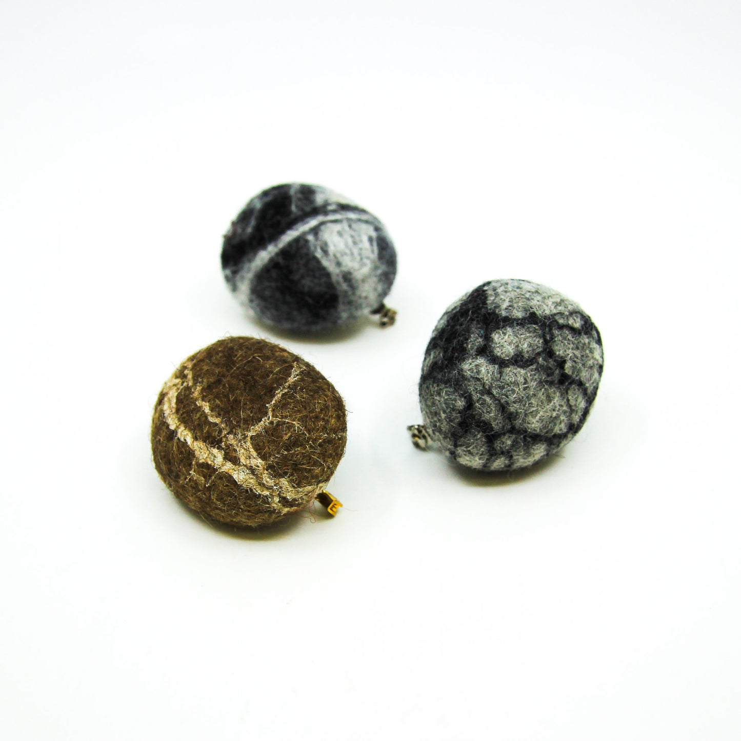 Felted rocks with pins