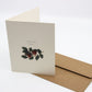 Watercolour image of a branch of red berries and green leaves. Text: to one that I love. 