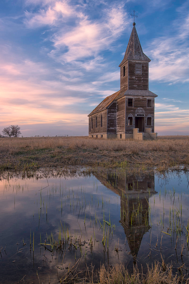 Photograph of a church and its reflection in a lake 