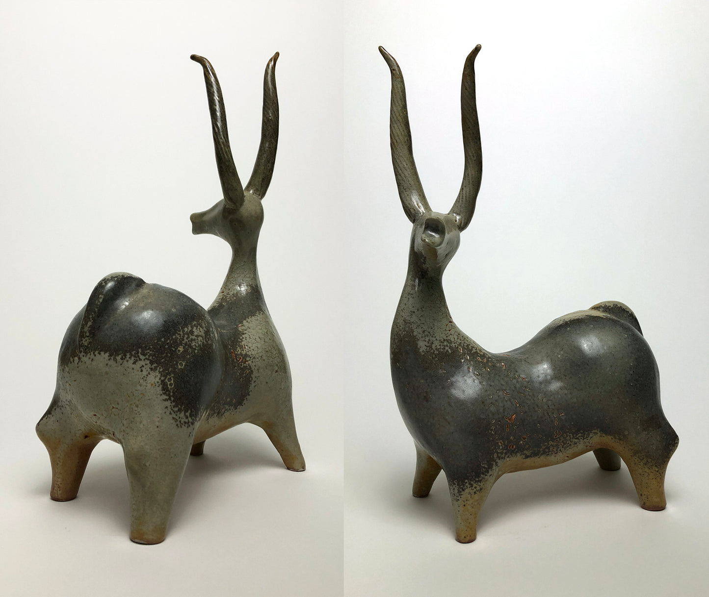 Clay sculpture of brown stag with long horns 