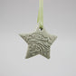 Green star embossed with baroque floral pattern 